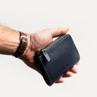 Leather wallets for men, navy minimalist wallet held in hand
