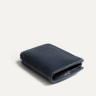 Compact ladies leather wallet in blue grained leather, folded and zipped.