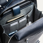 sac à dos pour ordinateur avec rangements pensés pour le travail, carnet, stylo et accessoires.