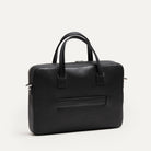 Vue arrière d’un sac homme travail avec poignées renforcées et passant pour trolley signé lundi.