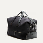 Sac de voyage homme élégant en toile noire avec finitions cuir, idéal comme sac de sport ou sac week end pour homme.