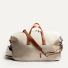 Sac de sport homme REMINGTON beige avec compartiment à chaussures pour éviter de salir les vêtements et bandoulière ajustable pour être confortable.