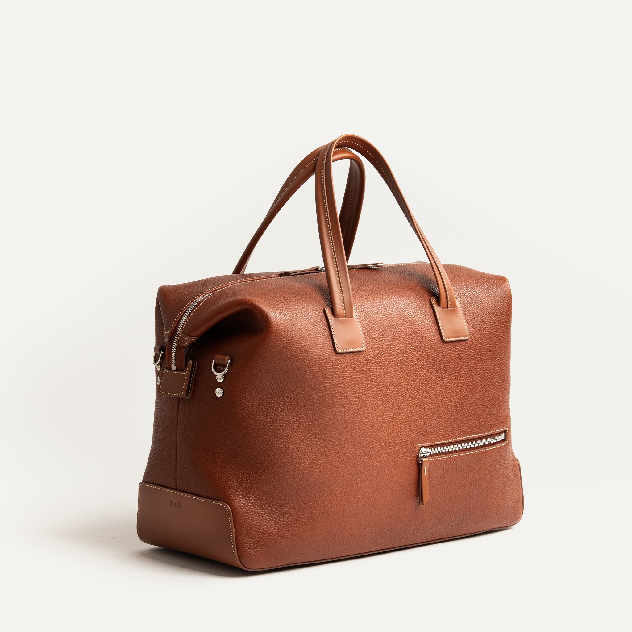 Sac de voyage en cuir marron élégant, format cabine idéal homme et femme, modèle 48 heures.