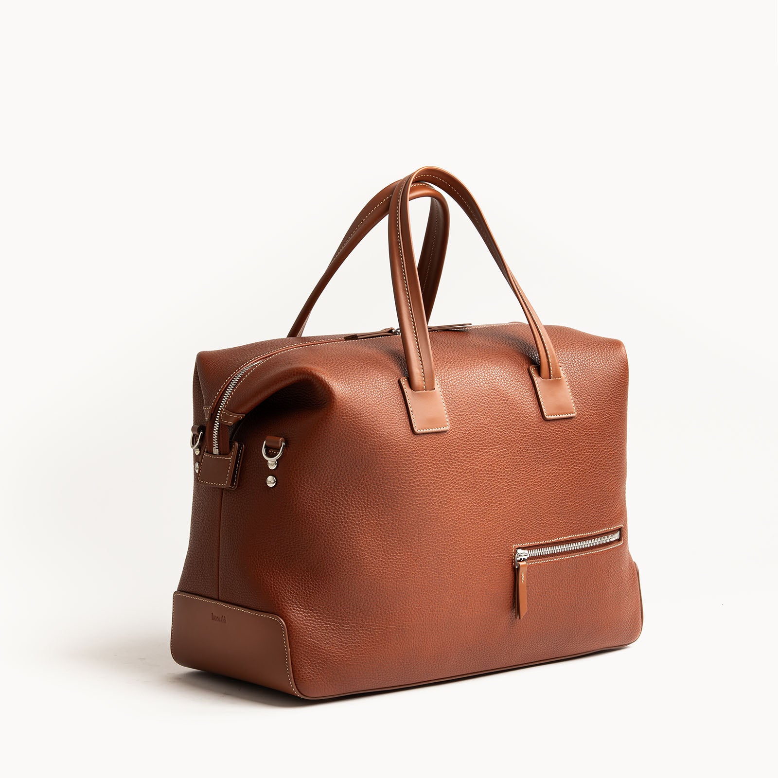 Sac de voyage en cuir marron élégant, format cabine idéal homme et femme, modèle 48 heures.