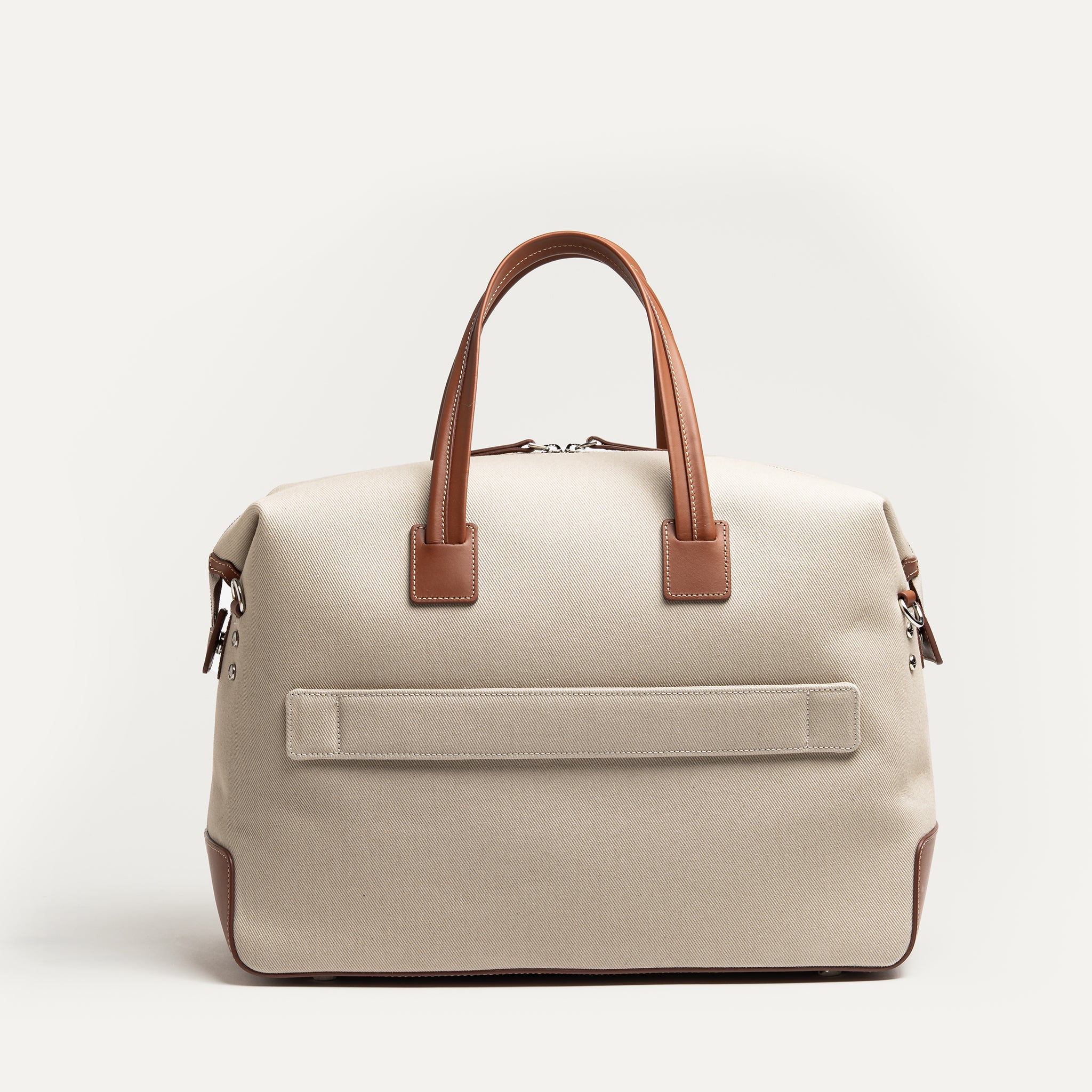 Sac de voyage en cuir et toile, avec intérieur doublé en Alcantara, compatible cabine 48 h.