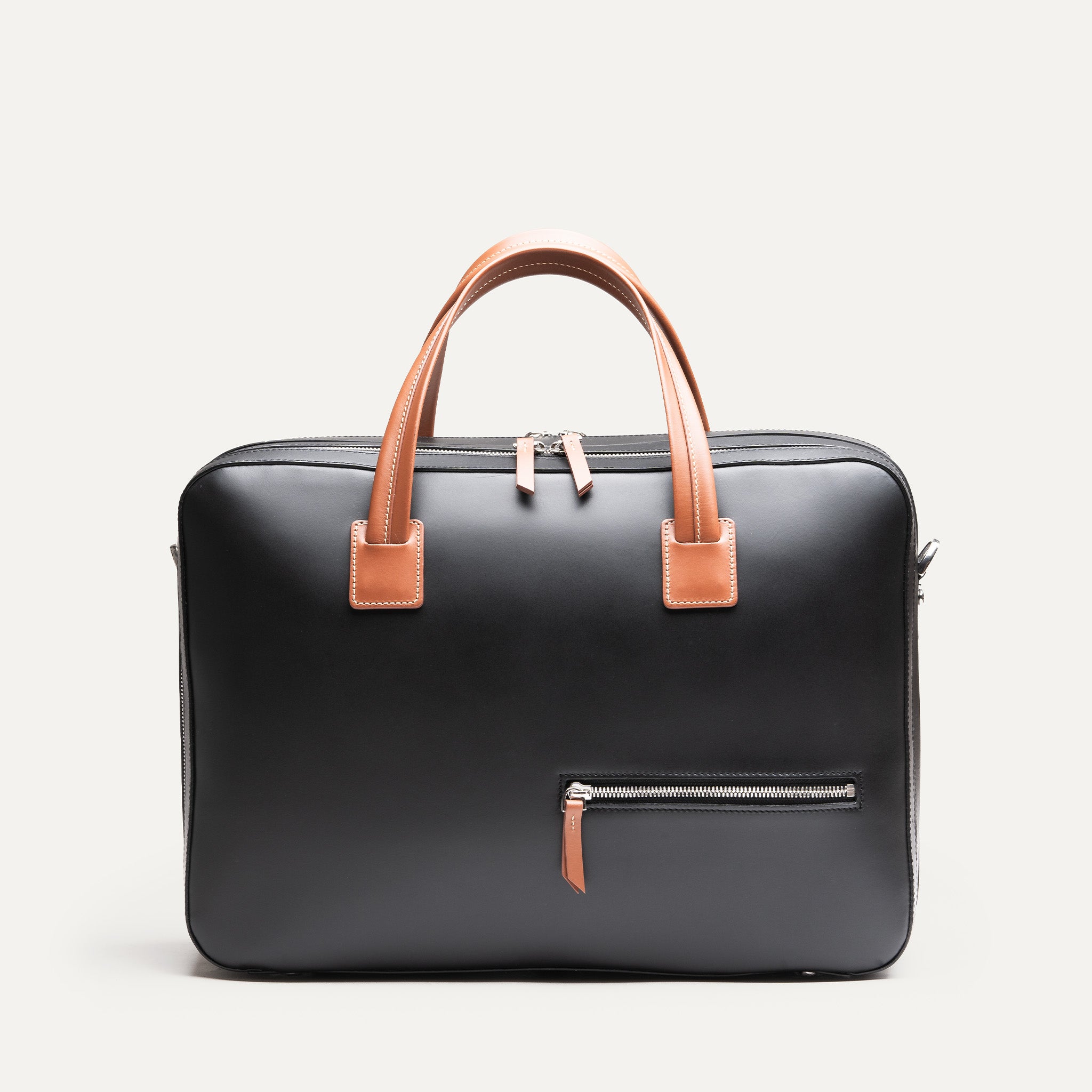 Sac à main Bellecourt lundi en cuir noir et cognac.