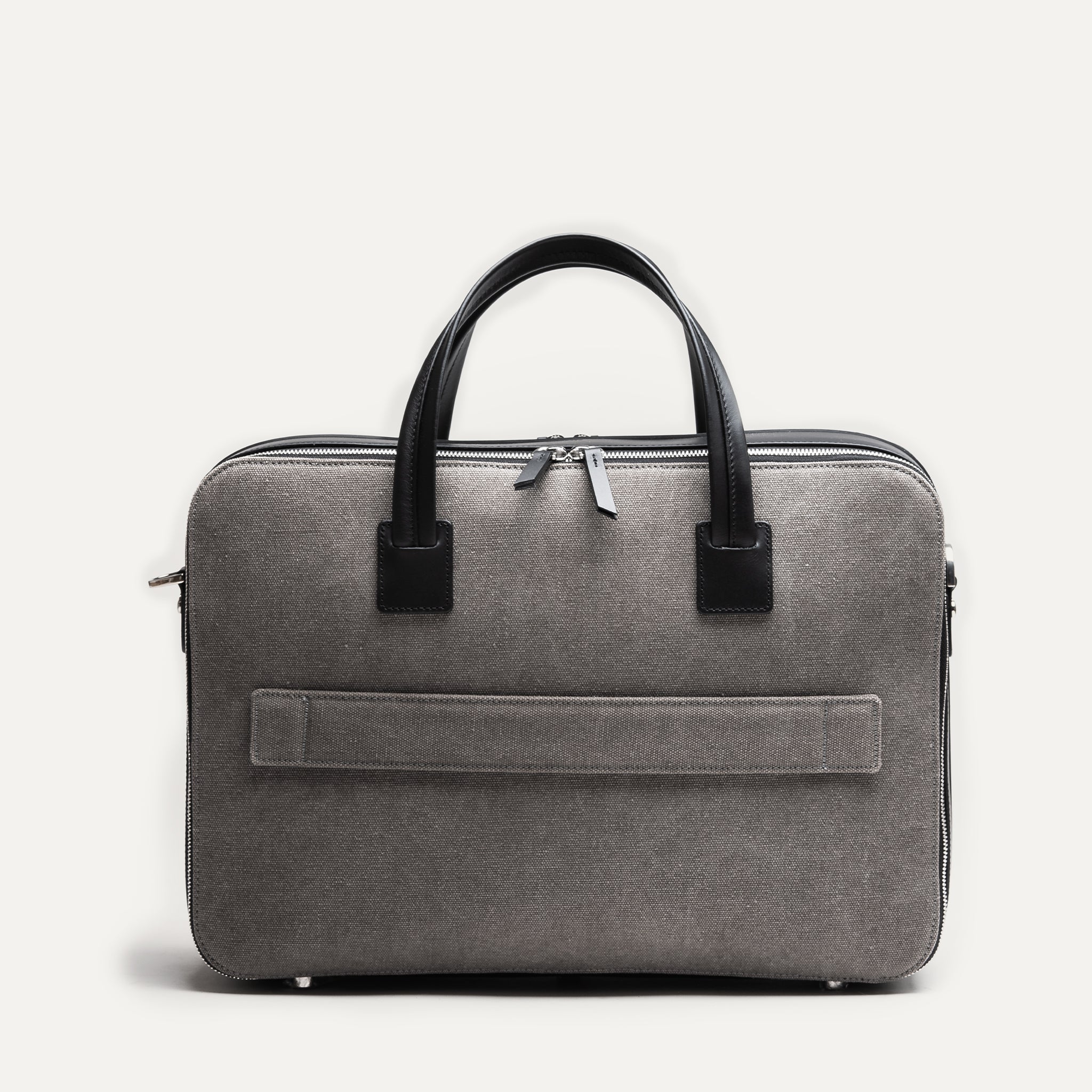 Sac cuir homme CONALLY associant toile de coton grise et cuir noir, pour un style élégant et robuste.