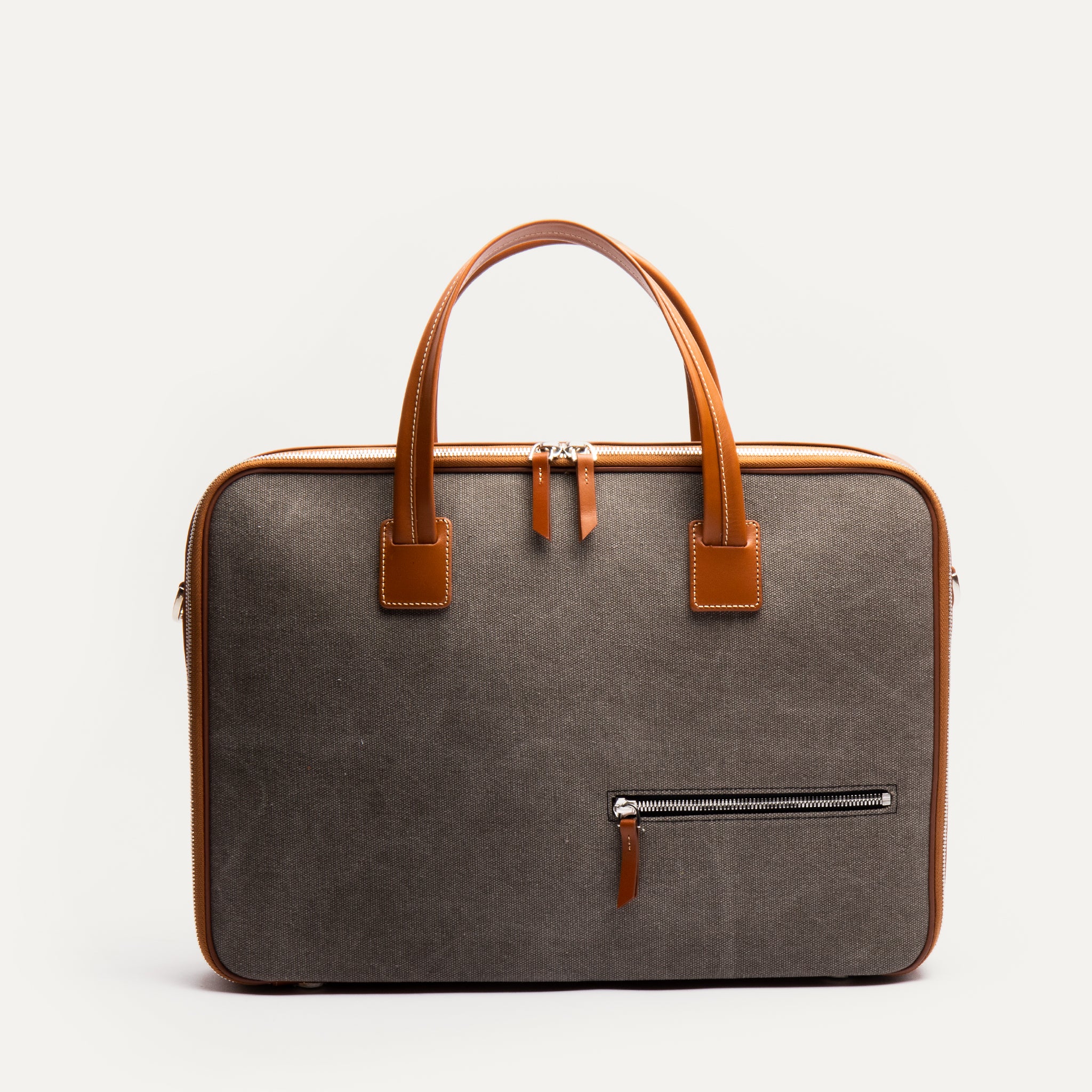 Porte document en cuir et toile cognac.