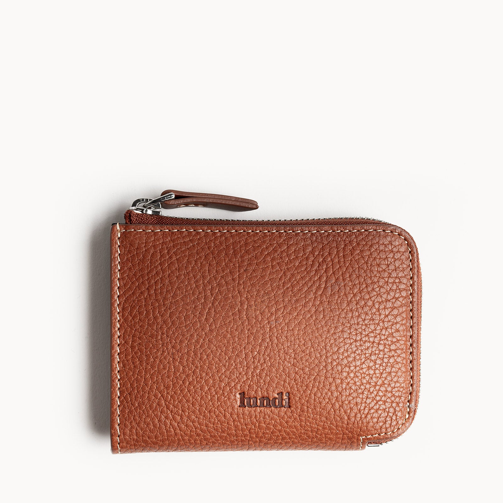 Portefeuille homme cuir​ de couleur cognac compact zippé, compartiments cartes, billets et pièce d’identité.